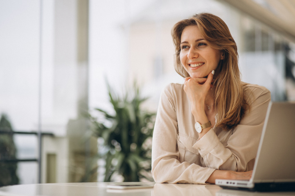 Portrait business woman working laptop